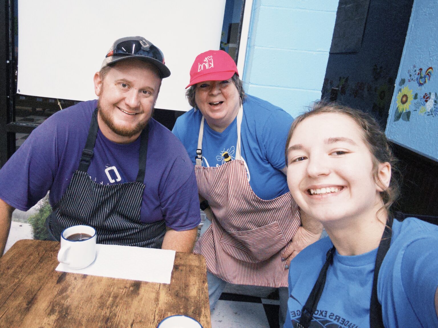 Viktoriia's host dad, John, Glenda, and Viktoriia posting for a picture.