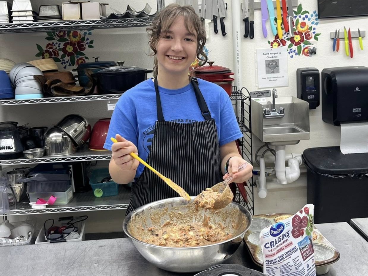 Viktoriia mixing batter.